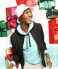 Woman in a black jacket and white Bike Swoosh Bucket cap surrounded by colorful gift boxes