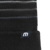 Close up of TravisMathew Woven Tag on Striped Cuffed Beanie