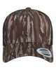 YP Classics 6606 retro trucker hat in Realtree Original/ Black with custom laser engraved Hermann Oak leather patch