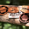 Laser-engraved leather patches in Hermann Oak and faux leather options, used for custom hat decoration at Printing Studio.